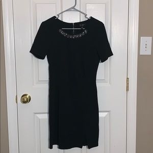 Black sleeved dress with beaded neck line